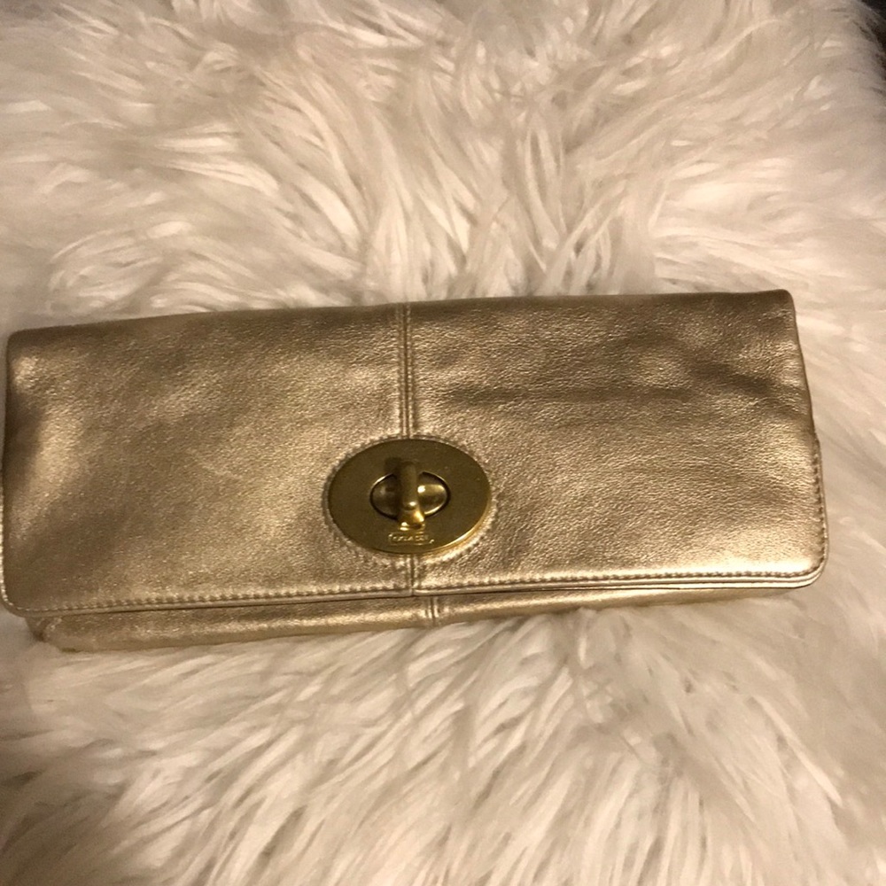 Gold coach clutch purse